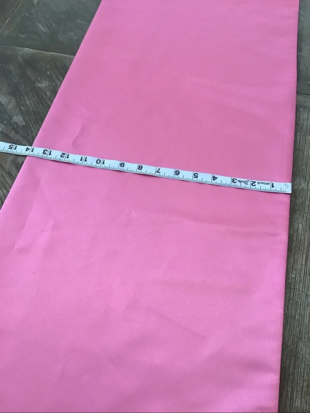Table runner features a decorative white lace and ribbon trim